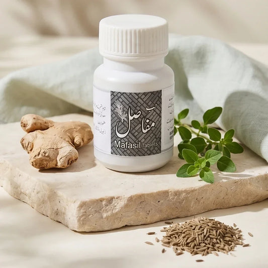 Mafasil Tablets bottle with ginger and herbal ingredients on a stone slab.