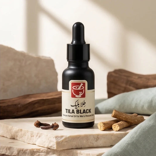 Tila Black premium herbal oil bottle for men's personal care on a stone pedestal.
